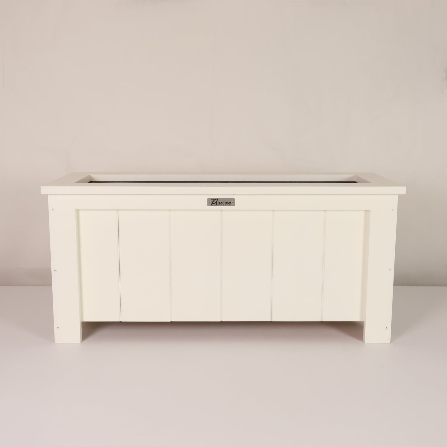 Modern, large, white coloured outdoor planter box, chemical free, made of macrocarpa timber. 