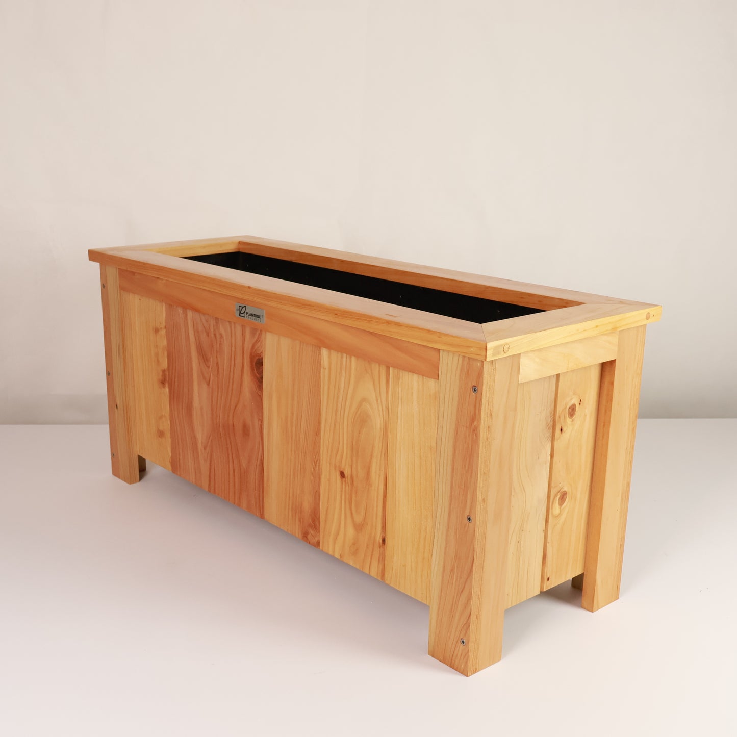 Modern, large, natural finish, outdoor planter box, chemical free, made of macrocarpa timber. 