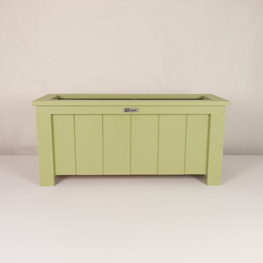 Modern, large, green coloured outdoor planter box, chemical free, made of macrocarpa timber. 