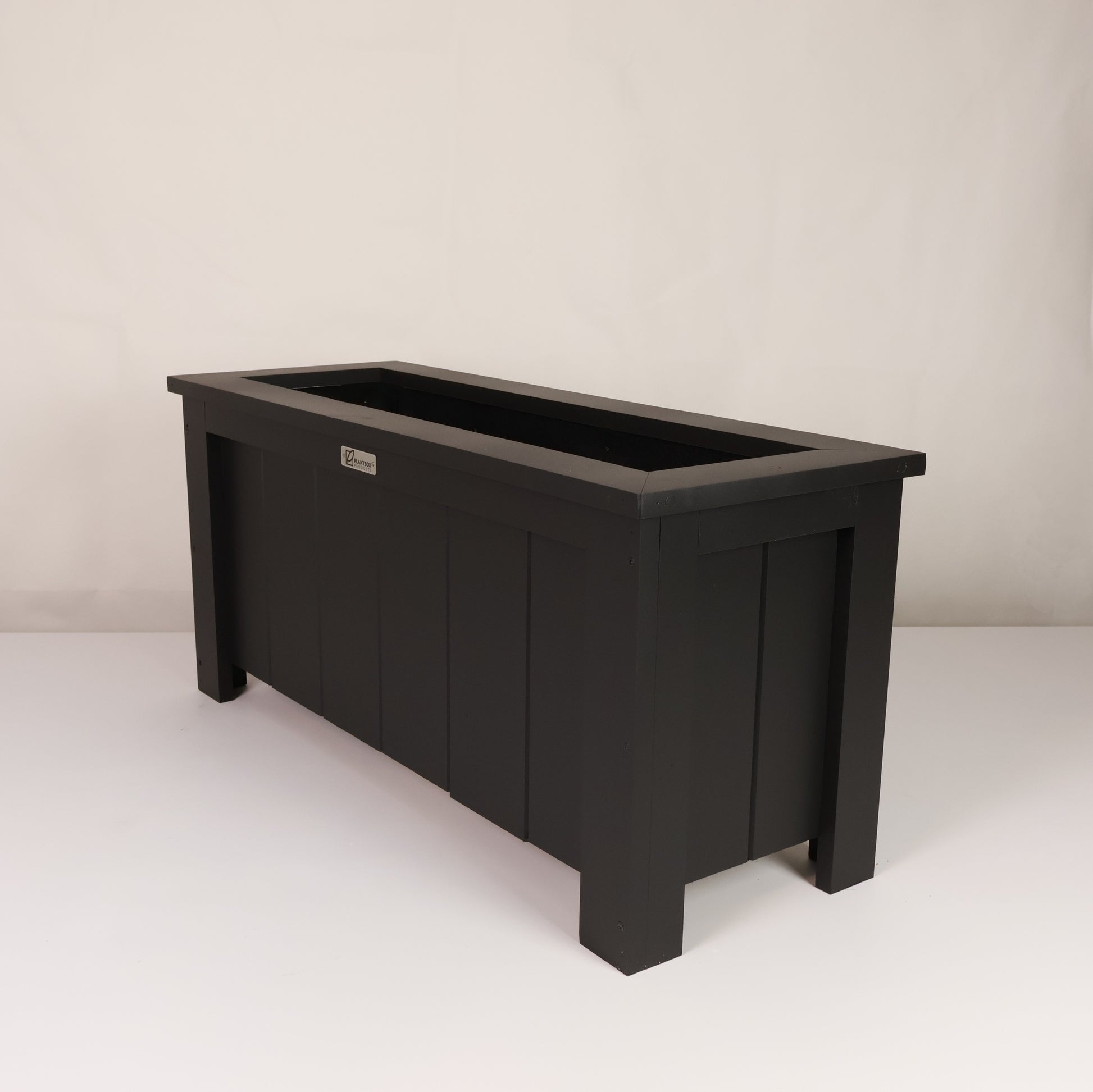 Modern, large, black finish, outdoor planter box, chemical free, made of macrocarpa timber. 